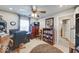 Bedroom with ceiling fan, carpet, chest of drawers, bookcase and desk; well lit with plenty of storage space at 8318 Golden Ridge Ln, Indianapolis, IN 46237