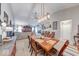 Elegant dining room featuring vaulted ceilings and seamlessly blends into the living space at 8318 Golden Ridge Ln, Indianapolis, IN 46237