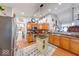 Kitchen with a center island, stainless steel appliances, and access to the living and dining areas at 8318 Golden Ridge Ln, Indianapolis, IN 46237