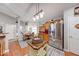 Cozy kitchen with wood floors, a breakfast nook, and modern stainless steel appliances at 8318 Golden Ridge Ln, Indianapolis, IN 46237