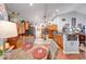 Bright and airy kitchen featuring a breakfast bar, wood floors, and contemporary decor at 8318 Golden Ridge Ln, Indianapolis, IN 46237