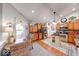 Well-lit kitchen with wood floors features an eat-in dining area and modern stainless steel appliances at 8318 Golden Ridge Ln, Indianapolis, IN 46237