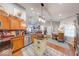 Well-lit kitchen featuring wood cabinets, stainless steel appliances, and an island with dining area at 8318 Golden Ridge Ln, Indianapolis, IN 46237