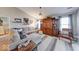Cozy living room featuring plush sectional, patterned rug, and elegant wooden cabinet at 8318 Golden Ridge Ln, Indianapolis, IN 46237