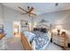 Spacious main bedroom with a ceiling fan and decoratively ornate furnishings at 8318 Golden Ridge Ln, Indianapolis, IN 46237