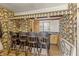 Wet bar featuring unique wallpaper and bar seating at 847 Churchman Ave, Beech Grove, IN 46107