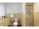 Cozy bathroom featuring classic tile, a toilet, and shower at 847 Churchman Ave, Beech Grove, IN 46107