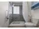 Bathroom with stylish gray tile shower and grab bar at 847 Churchman Ave, Beech Grove, IN 46107