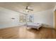 Bright bedroom with hardwood floors, corner windows, and a ceiling fan at 847 Churchman Ave, Beech Grove, IN 46107