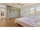 Comfortable bedroom featuring hardwood floors and spacious closet storage at 847 Churchman Ave, Beech Grove, IN 46107