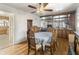 Cozy dining area with wood floors and an ornate table, adjacent to the kitchen at 847 Churchman Ave, Beech Grove, IN 46107