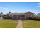 Charming brick home with a covered front porch and well-maintained landscaping at 847 Churchman Ave, Beech Grove, IN 46107