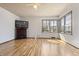 Bright living room with fireplace and large window at 847 Churchman Ave, Beech Grove, IN 46107
