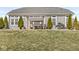 Well-maintained backyard featuring a covered pergola with view of the house at 8759 Buttonbush Cir, Plainfield, IN 46168
