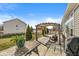 View of a backyard patio with pergola, chairs, and grill for outdoor enjoyment at 8759 Buttonbush Cir, Plainfield, IN 46168