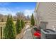 Landscaped backyard featuring lush greenery, a gravel path, and well-maintained lawn at 8759 Buttonbush Cir, Plainfield, IN 46168