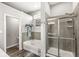 Bathroom with a tub, walk-in shower, and modern fixtures at 8759 Buttonbush Cir, Plainfield, IN 46168