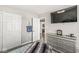 Cozy bedroom with dresser, tv and access to the bathroom at 8759 Buttonbush Cir, Plainfield, IN 46168