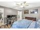 Bedroom with laminate flooring, ceiling fan, and walk-in closet at 8759 Buttonbush Cir, Plainfield, IN 46168