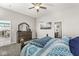 Bedroom with a large bed, a dresser and an en-suite bathroom at 8759 Buttonbush Cir, Plainfield, IN 46168