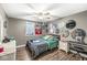Bedroom with laminate flooring, neutral paint, and a ceiling fan at 8759 Buttonbush Cir, Plainfield, IN 46168