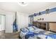 Bedroom with closet, blue accents, and sporty decor at 8759 Buttonbush Cir, Plainfield, IN 46168