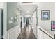 Inviting hallway featuring attractive flooring, fresh wall paint and white trim and doors at 8759 Buttonbush Cir, Plainfield, IN 46168