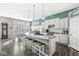 Spacious kitchen with a large island, modern appliances, and stylish pendant lighting at 8759 Buttonbush Cir, Plainfield, IN 46168
