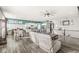 Expansive open-concept living space with view of kitchen and staircase at 8759 Buttonbush Cir, Plainfield, IN 46168