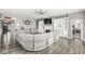 Spacious living room featuring a fireplace, built-in shelving and modern ceiling fan at 8759 Buttonbush Cir, Plainfield, IN 46168