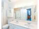 Bright bathroom has a double sink vanity and medicine cabinet providing ample storage and functionality at 915 Prestwick Dr # D, Indianapolis, IN 46214