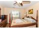 This inviting bedroom features a four-poster bed, and a large window for natural light at 915 Prestwick Dr # D, Indianapolis, IN 46214