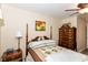 Relaxing bedroom with a four-poster bed, wood floors, and ample natural light at 915 Prestwick Dr # D, Indianapolis, IN 46214