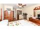 Spacious bedroom featuring a four-poster bed, wooden furniture, and neutral decor at 915 Prestwick Dr # D, Indianapolis, IN 46214