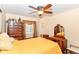 Cozy bedroom with a ceiling fan, dresser, and vanity for a relaxing space at 915 Prestwick Dr # D, Indianapolis, IN 46214
