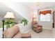 A bright space features comfortable seating with a window view, ideal for relaxation and quiet enjoyment at 915 Prestwick Dr # D, Indianapolis, IN 46214