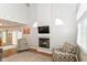 Comfortable living room showcasing a fireplace, vaulted ceiling and neutral wall color at 915 Prestwick Dr # D, Indianapolis, IN 46214