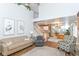Inviting living room featuring a high ceiling, with an adjacent dining area and staircase at 915 Prestwick Dr # D, Indianapolis, IN 46214