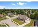 Aerial view of a residential home in a suburban neighborhood surrounded by lush green trees and blue skies at 10890 Poppy Hill Dr, Indianapolis, IN 46234