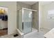 Contemporary bathroom with large shower and glass door, tiled walls, and a window at 10890 Poppy Hill Dr, Indianapolis, IN 46234