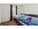 Bedroom showcasing two beds with unique patterned comforters and dark curtains at 10890 Poppy Hill Dr, Indianapolis, IN 46234