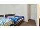 Spacious bedroom showcases twin beds with patterned comforters and carpeted flooring at 10890 Poppy Hill Dr, Indianapolis, IN 46234