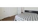Bedroom with neutral carpet and a gray and white plaid bedspread at 10890 Poppy Hill Dr, Indianapolis, IN 46234