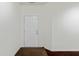 Entryway with a white front door, neutral paint and dark hardwood flooring at 10890 Poppy Hill Dr, Indianapolis, IN 46234