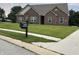 Beautiful brick single-story home featuring a well-manicured lawn and a charming mailbox at 10890 Poppy Hill Dr, Indianapolis, IN 46234