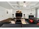 Living room with fireplace, a coffered ceiling, modern furnishings and a large screen TV at 10890 Poppy Hill Dr, Indianapolis, IN 46234