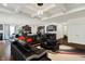 Open living area featuring modern furnishings, lighting, and views of the kitchen and dining area at 10890 Poppy Hill Dr, Indianapolis, IN 46234