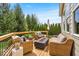 Cozy back deck featuring comfortable wicker seating and a modern fire pit table at 11367 Zanardi Ct, Zionsville, IN 46077