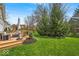 Beautiful backyard featuring a deck with patio furniture and a well-manicured lawn at 11367 Zanardi Ct, Zionsville, IN 46077