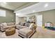 Finished basement with comfortable sectional, carpet floors, and neutral wall color at 11367 Zanardi Ct, Zionsville, IN 46077
